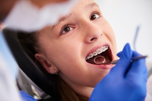 Girl with braces during a routine